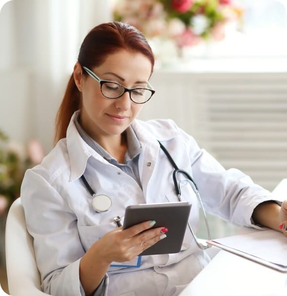 Medical cannabis doctor in Maryland reviewing patient information on a tablet during a consultation